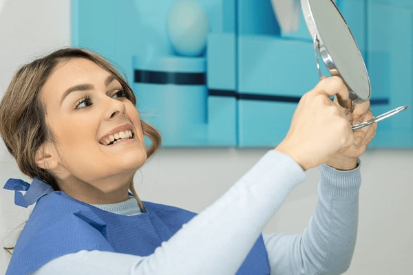 Dentist Examining a Patient’s All-on-4 Dental Implants at CDIC Islamabad